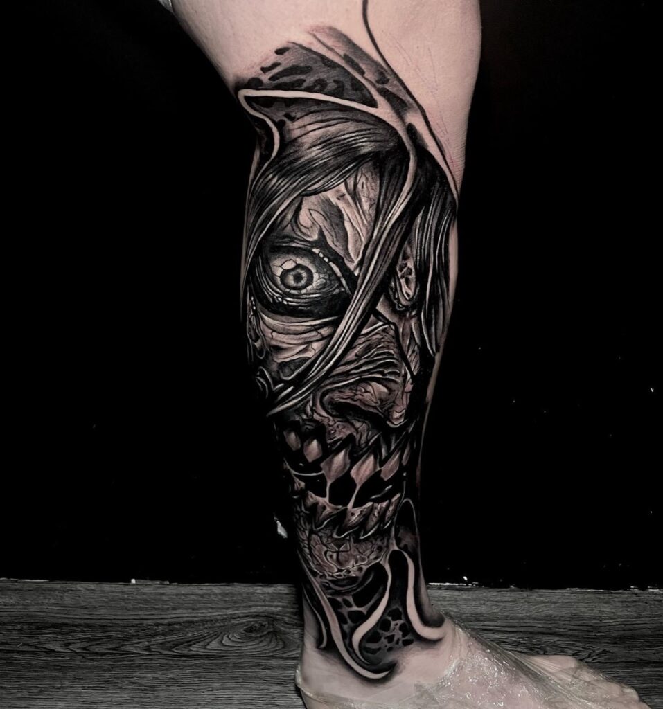 Black and grey horror realism tattoo on calf