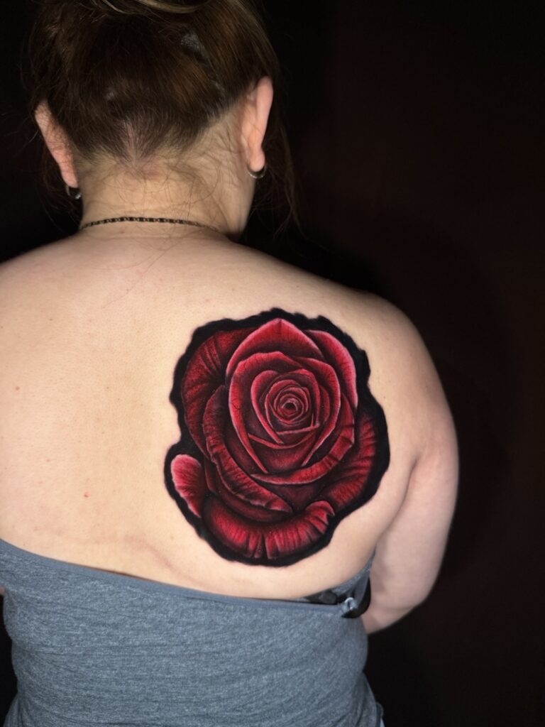 Full color realism rose tattoo on shoulder blade