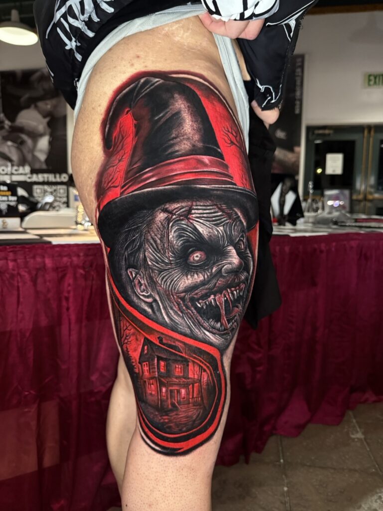Color horror tattoo of a witch with haunted house